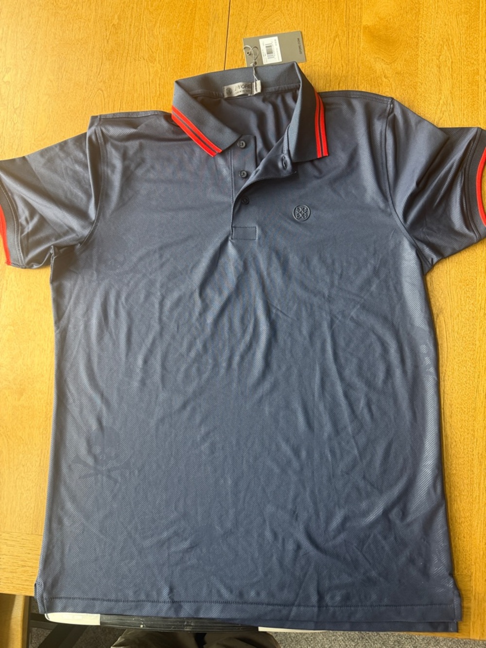 G/FORE Navy Polo with Red-Trim Collar with subtle skull and crossbones